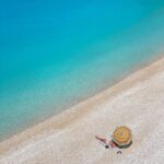 a person lying alone on an idyllic beach